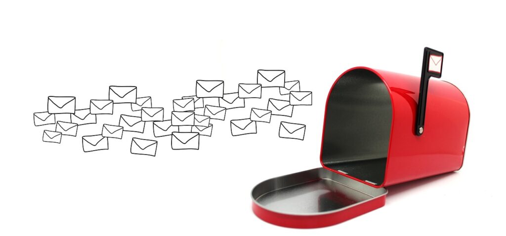 Outlines of envelopes flying through the air towards a bright red mailbox. Meant to signify email marketing.