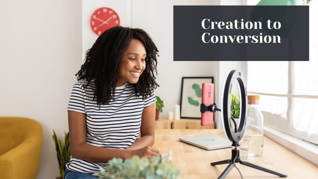 Female content creator sitting in front of her ring light and phone